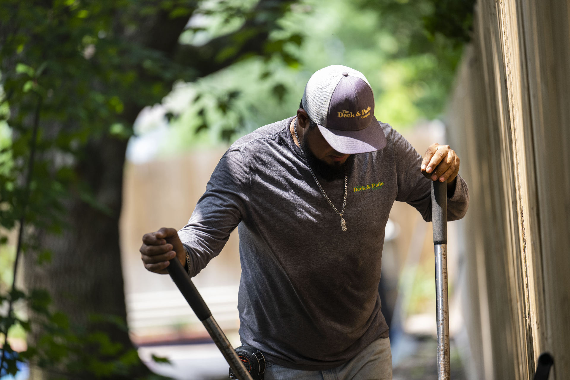 Deck & Patio crew member preparing a residential jobsite in Houston