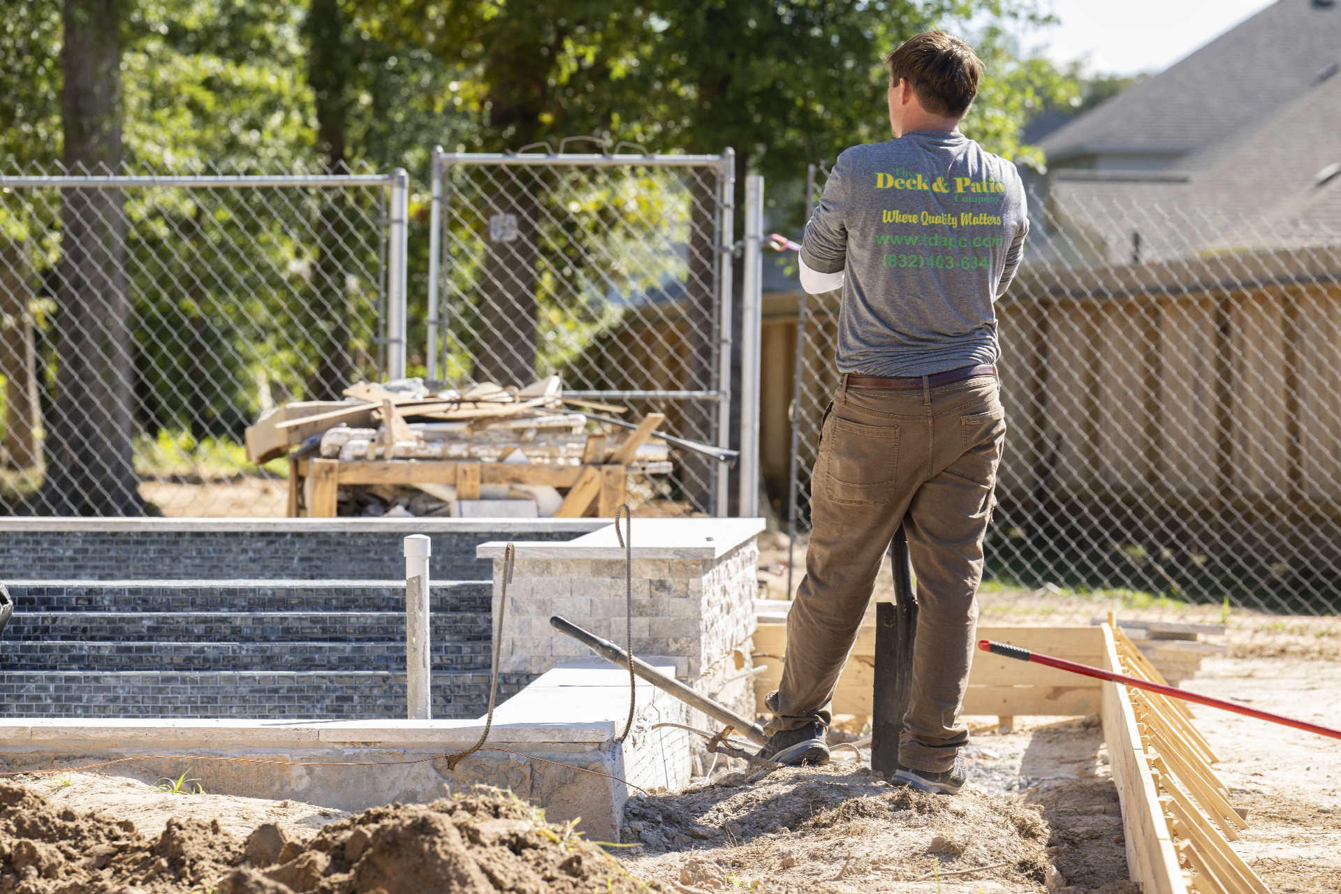 Pool and hardscape construction in progress at a Greater Houston backyard