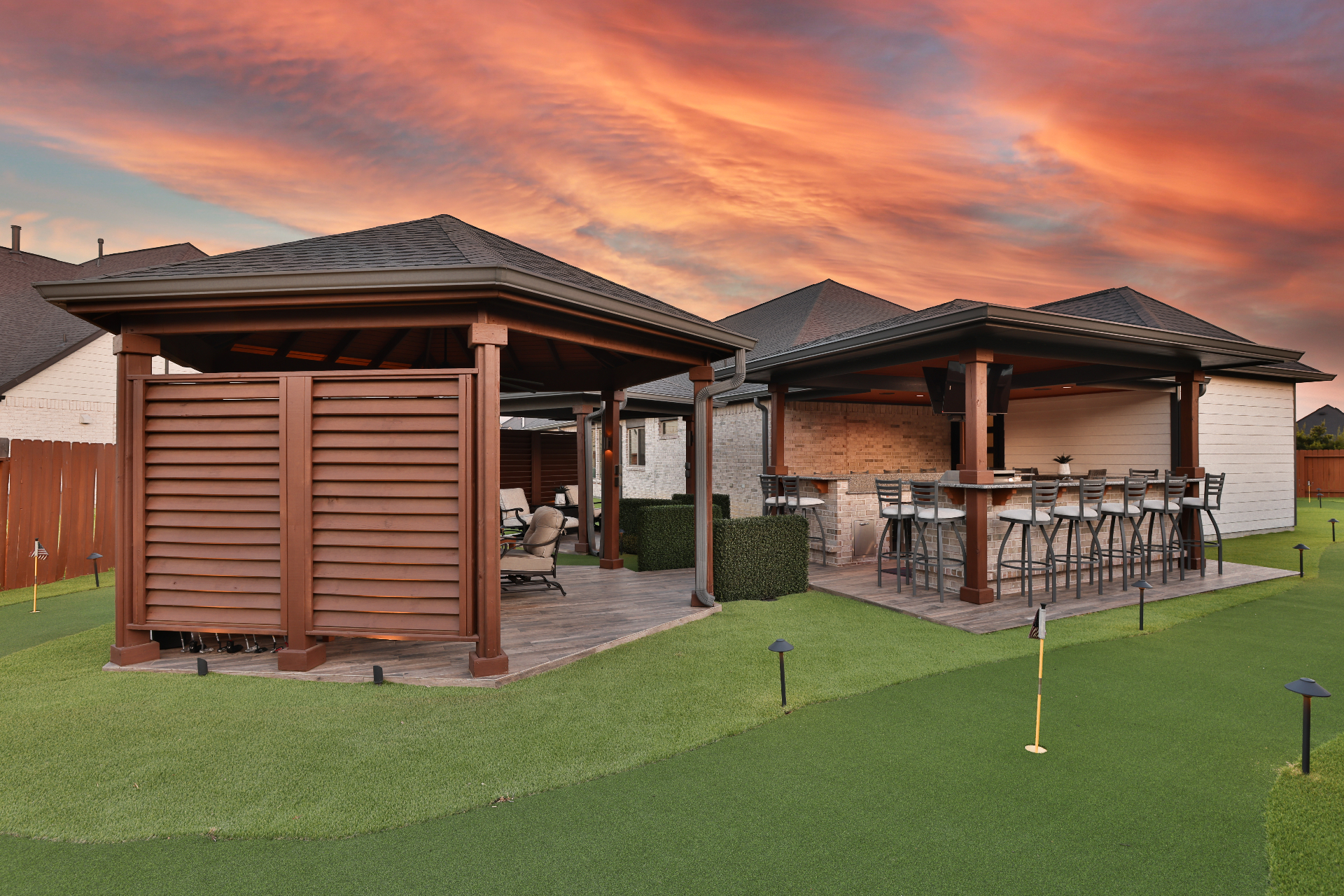 Luxury outdoor pavilion with golf green and putting green at sunset