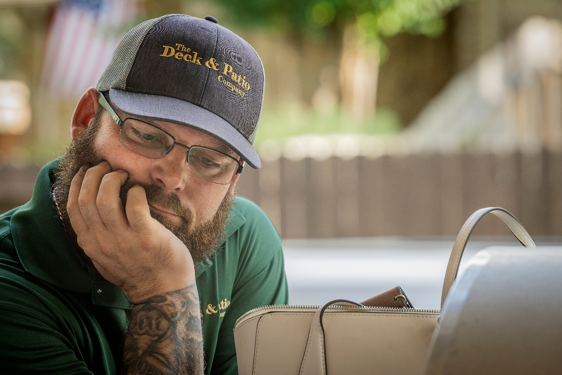 Jed Mowell, founder of The Deck & Patio Company, reviewing project plans on-site in Houston