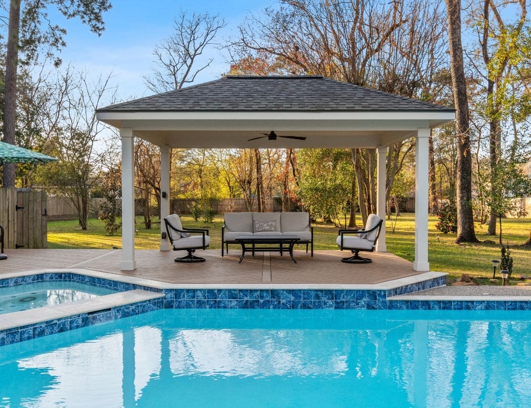 Poolside pavilion with hip roof and lounge seating