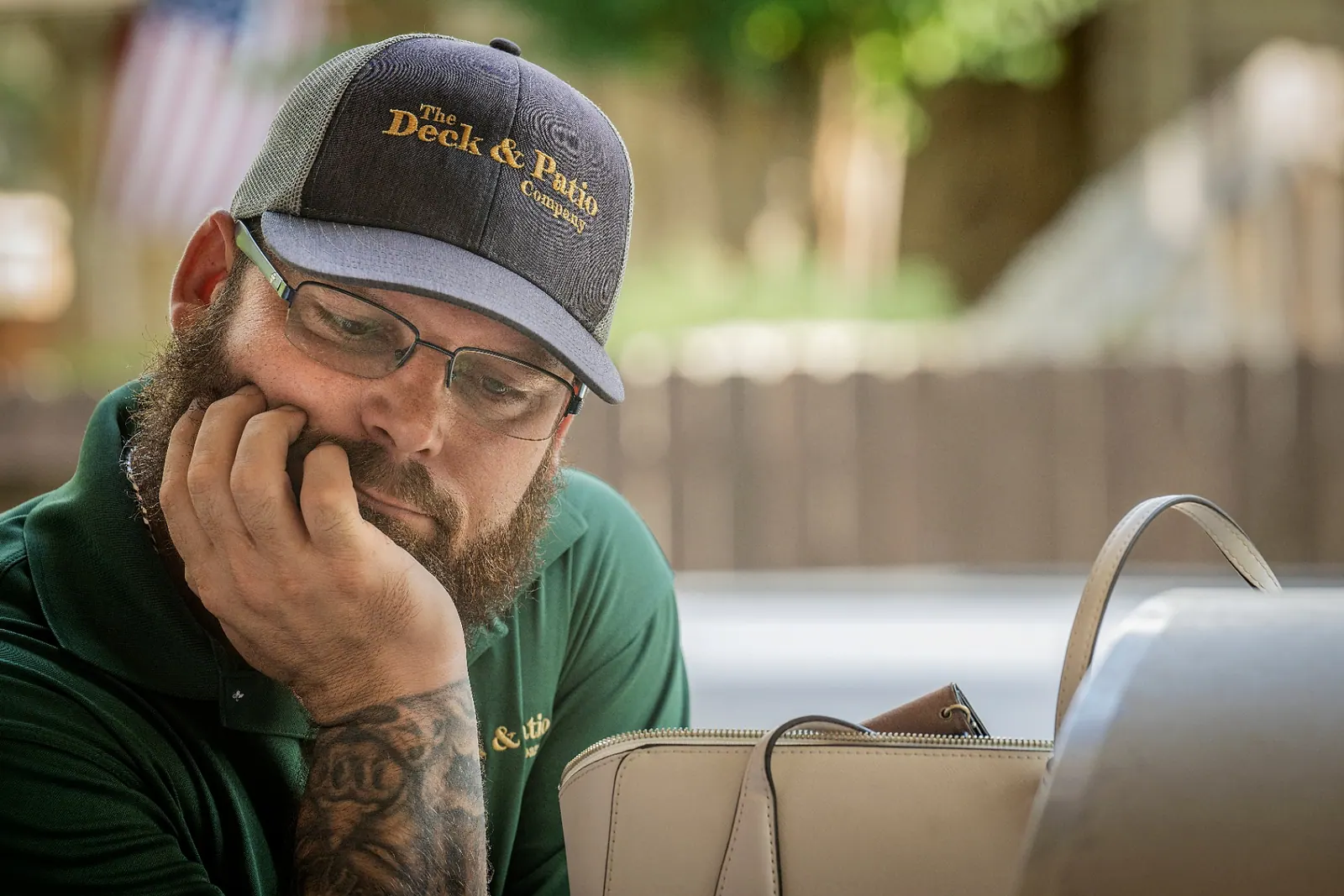Jed Mowell, founder of The Deck & Patio Company, reviewing project plans on-site in Houston