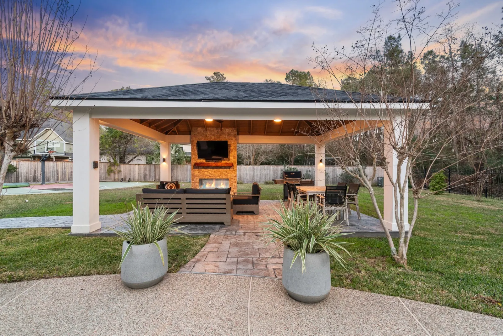 Custom veranda with fireplace and stone accents