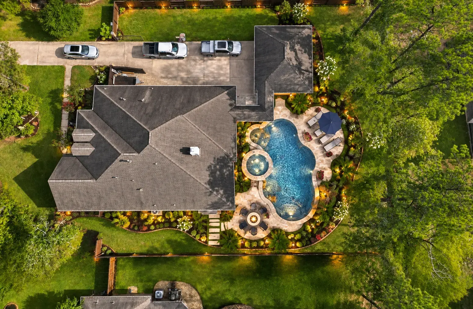 Established residential landscaping integrated with a refined outdoor living area