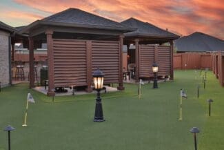 The Deck & Patio Company | A Backyard Built for Play, Relaxation & Year‑Round Enjoyment custom deck and backyard golf course