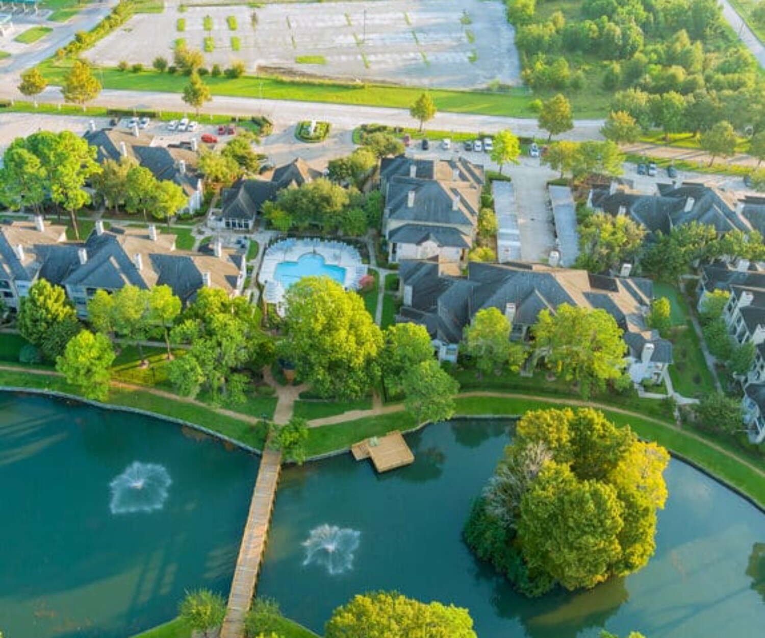 Aerial view of residential houses and driveways neighborhood during a fall sunset in Houston, Texas, US