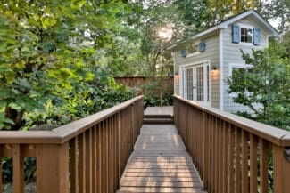 The Deck & Patio Company | A Peaceful Backyard Retreat Connected by Nature walk way, deck