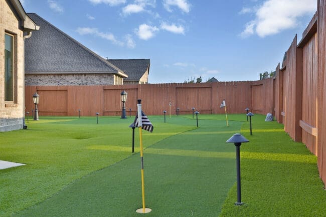 The Deck & Patio Company | A Backyard Built for Play, Relaxation & Year‑Round Enjoyment putting green