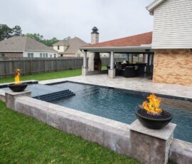 The Deck & Patio Company | Pools custom pool with fire feature in houston