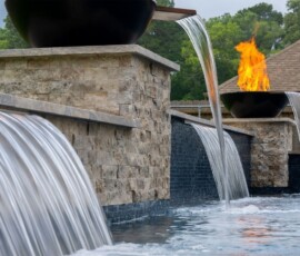 The Deck & Patio Company | Pools custom pool with fire feature in houston